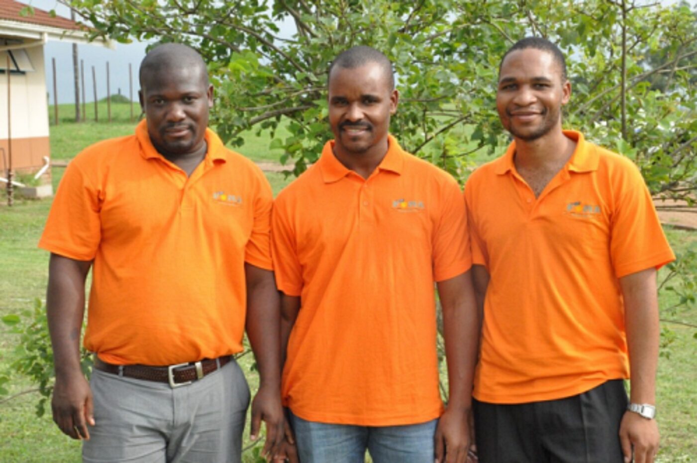France Nxumalo, Nkosingiphile Nyawo and Dumsani Gumede wearing orange golf t-shirts during a celebration day held at Mosvold Hospital
